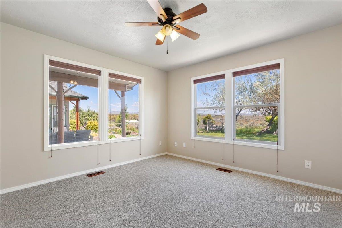 147 East Indian Crk Road Boise, ID 83716 - Photo 19 of 43 Neutral-toned interior room with light grey carpeting