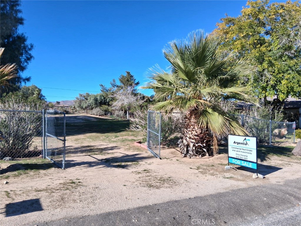 6896 Conejo Avenue Joshua Tree, CA 92252 - Photo 1 of 5 Gated entry onto lot