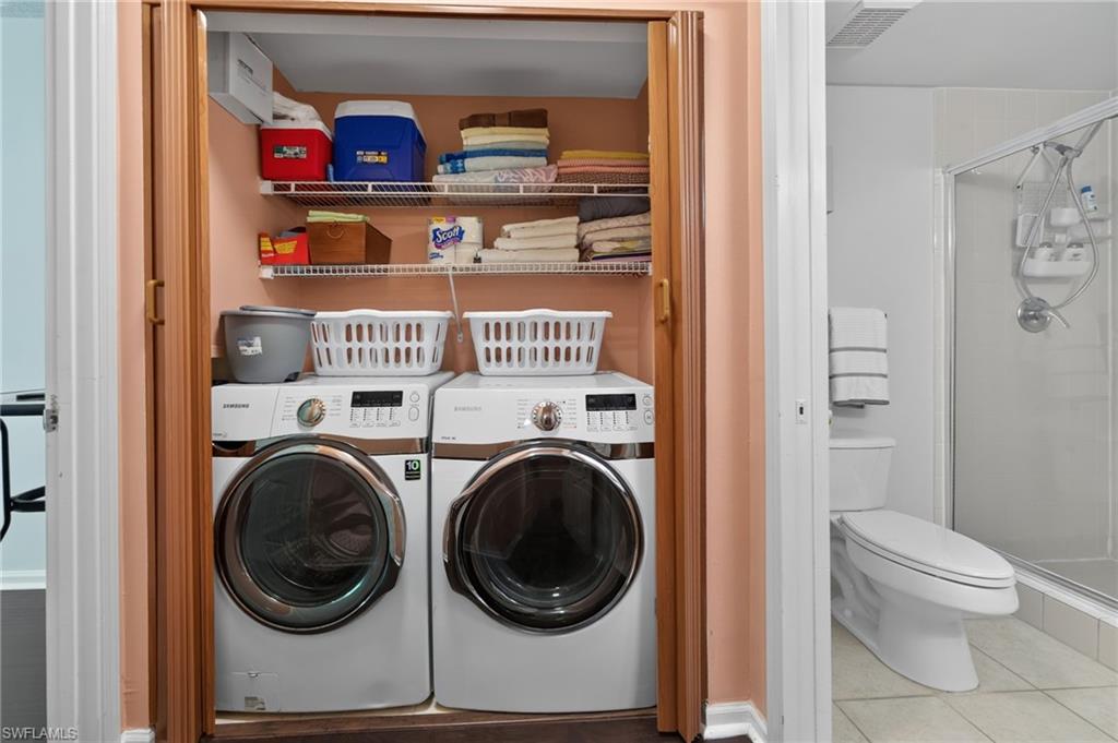 1105 Reserve Court, Unit 206 Naples, FL 34105 - Photo 12 of 23 a utility room with dryer and washer
