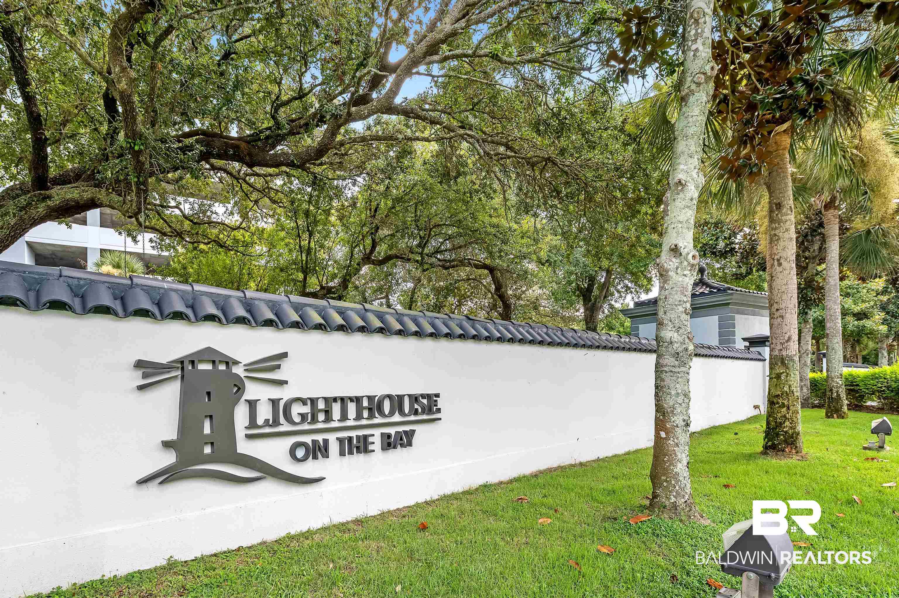 27582 Canal Road, Unit 2507 Orange Beach, AL 36561 - Photo 57 of 75 Community / neighborhood sign featuring a yard