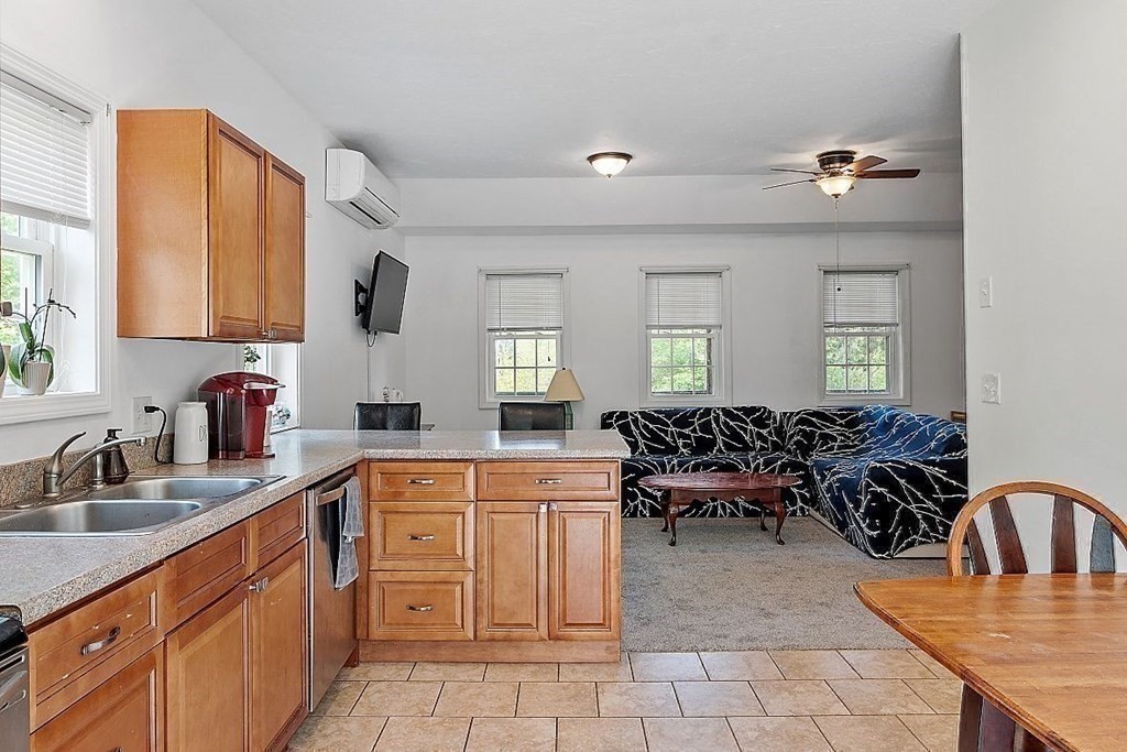 237 Spring Street Athol, MA 01331 - Photo 11 of 35 a large kitchen with kitchen island a sink stainless steel appliances and cabinets