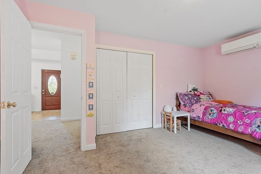 237 Spring Street Athol, MA 01331 - Photo 24 of 35 a bedroom with a bed and a chair