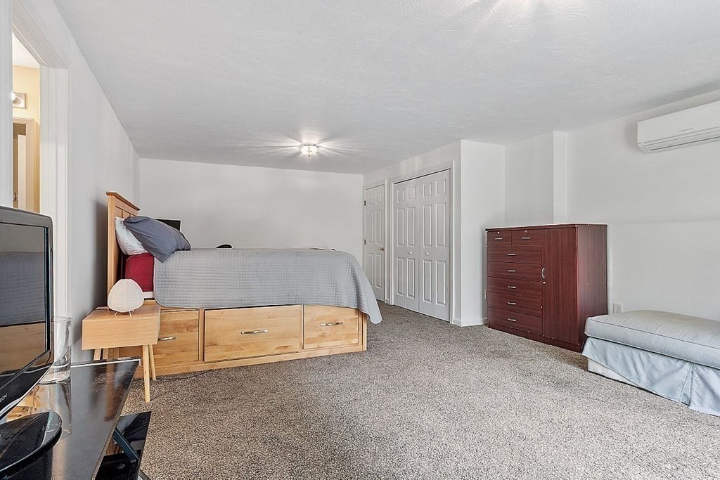 237 Spring Street Athol, MA 01331 - Photo 29 of 35 a bedroom with a bed and a dresser in it