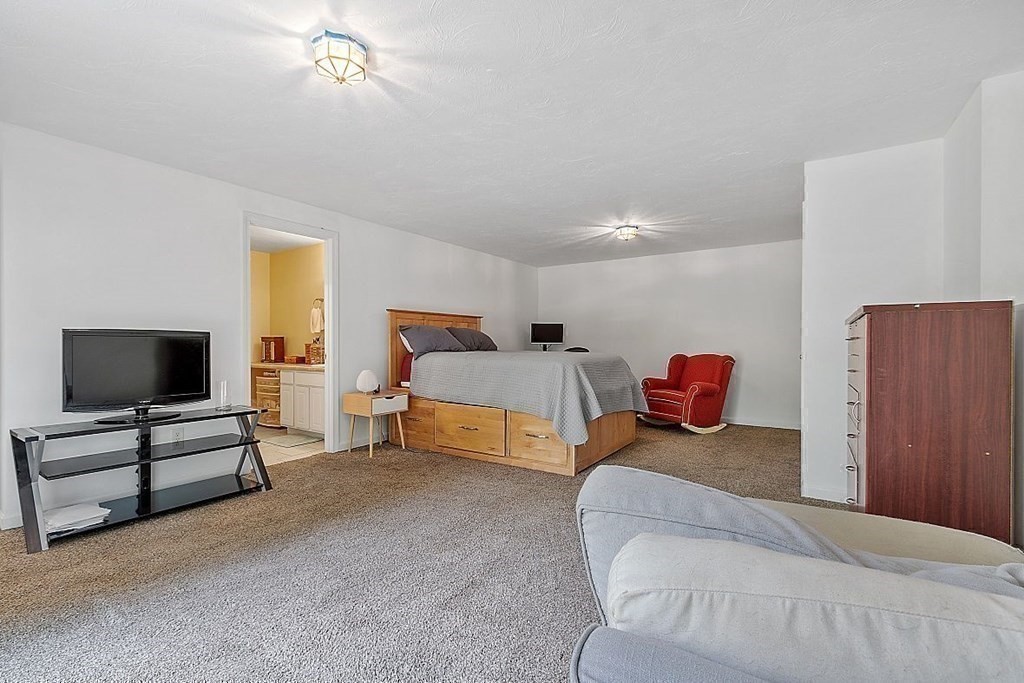 237 Spring Street Athol, MA 01331 - Photo 30 of 35 a bedroom with furniture and a flat screen tv