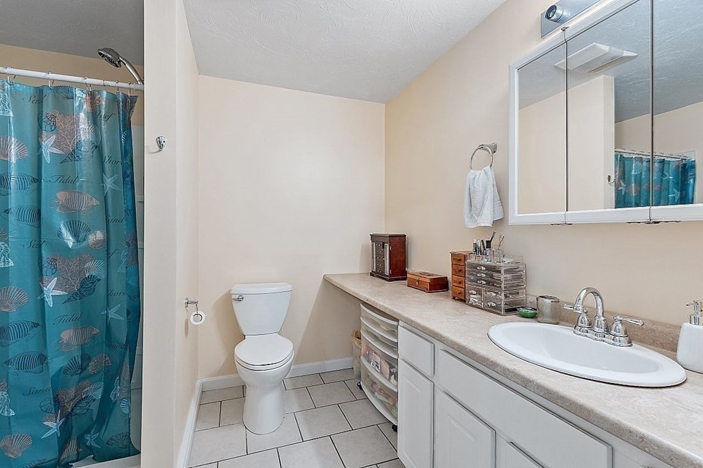 237 Spring Street Athol, MA 01331 - Photo 31 of 35 a bathroom with a sink a toilet and a mirror