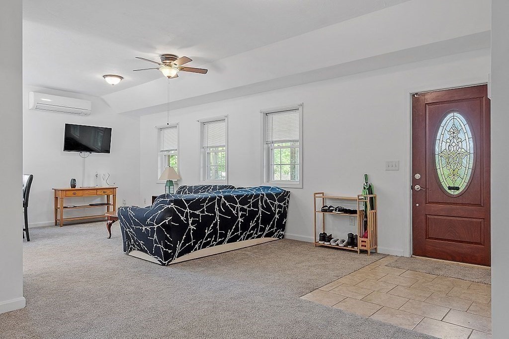 237 Spring Street Athol, MA 01331 - Photo 7 of 35 a spacious bedroom with a bed and a chandelier