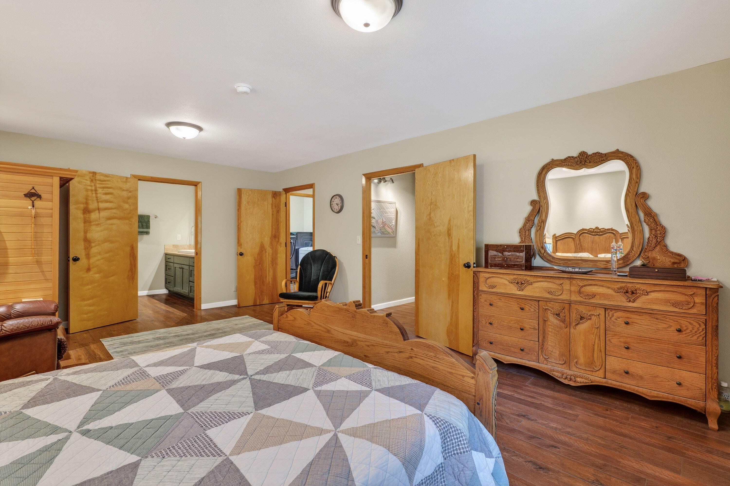 244 Riessen Road Grants Pass, OR 97526 - Photo 17 of 52 a bedroom with a bed and wooden floor