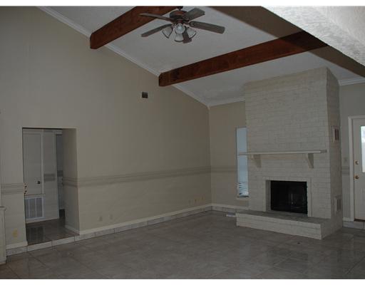 4929 Chatfield Drive Corpus Christi, TX 78413 - Photo 2 of 5 a view of empty room with fireplace