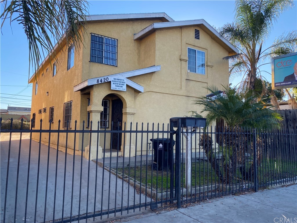 8420 South Broadway Los Angeles, CA 90003 - Photo 1 of 19 a front view of house along with deck and outdoor space