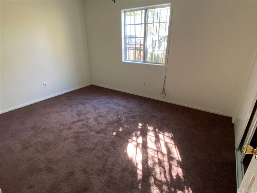 8420 South Broadway Los Angeles, CA 90003 - Photo 15 of 19 an empty room with a window
