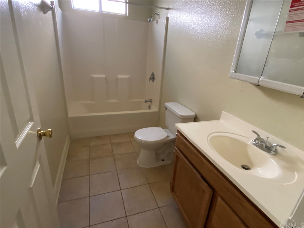8420 South Broadway Los Angeles, CA 90003 - Photo 18 of 19 a bathroom with a sink a toilet and shower