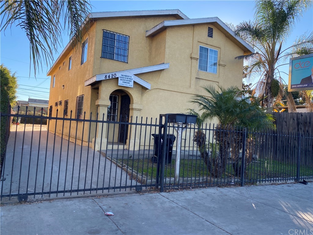 8420 South Broadway Los Angeles, CA 90003 - Photo 2 of 19 a front view of a house with a garden