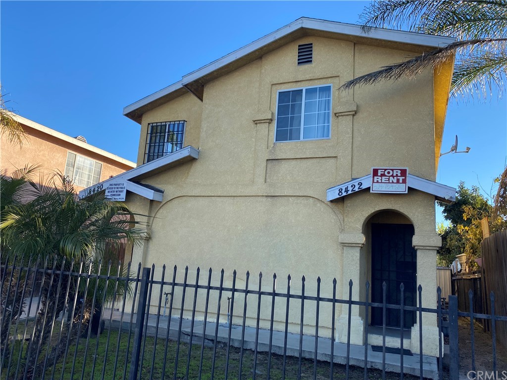 8420 South Broadway Los Angeles, CA 90003 - Photo 4 of 19 a front view of a house with a yard