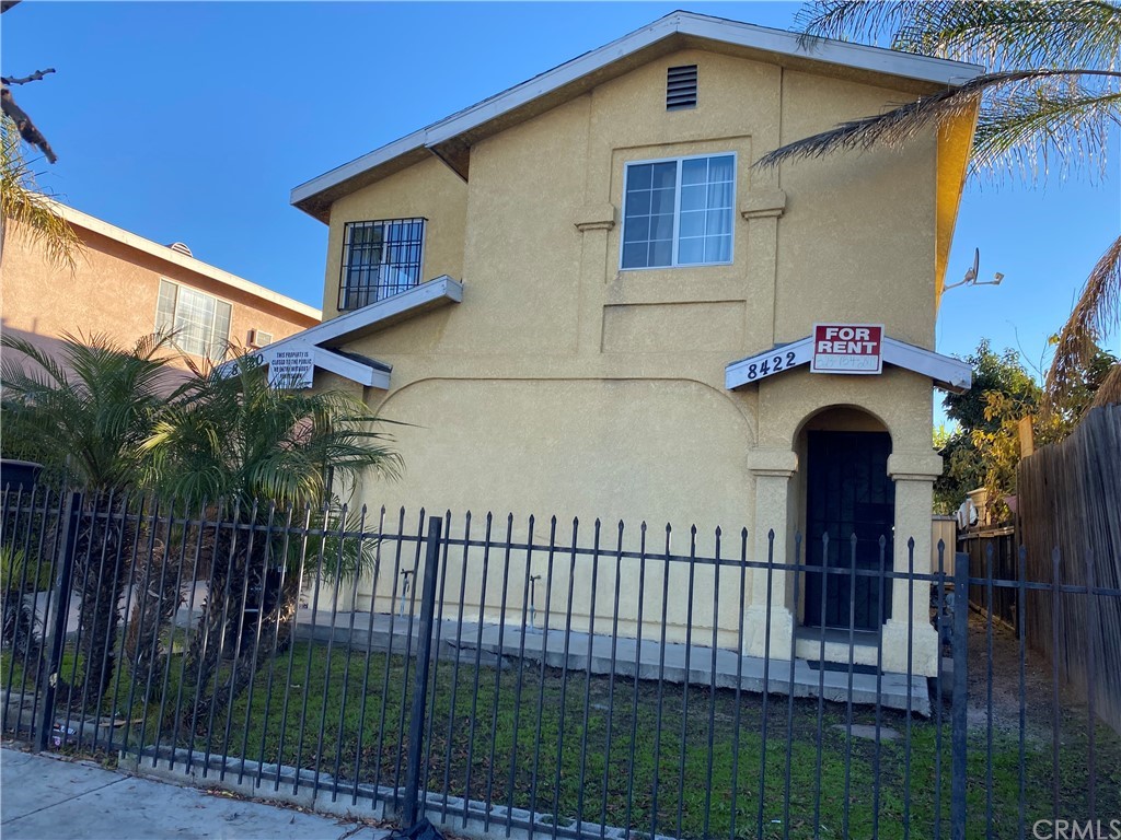 8420 South Broadway Los Angeles, CA 90003 - Photo 5 of 19 a front view of a house with a yard