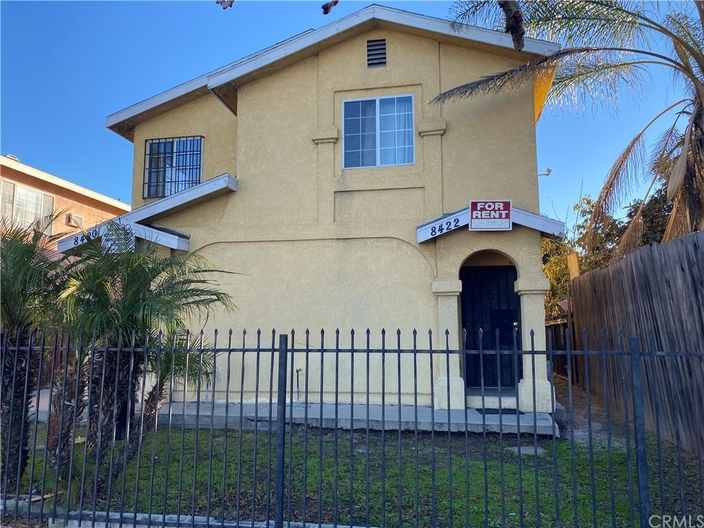 8420 South Broadway Los Angeles, CA 90003 - Photo 6 of 19 a front view of a house with a yard