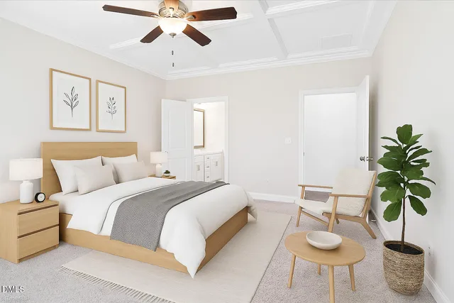 a bedroom with bed and a potted plant