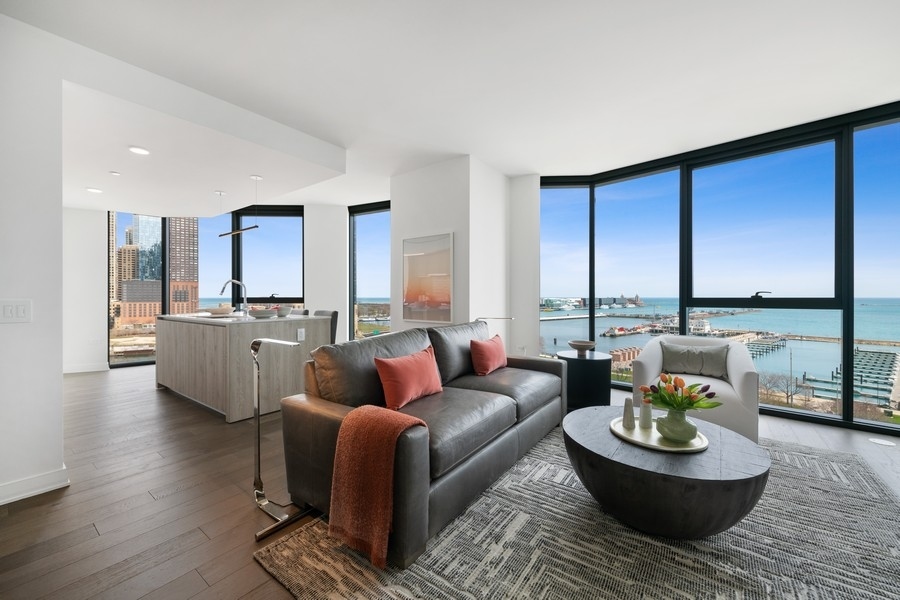 211 North Harbor Drive, Unit 2508 Chicago, IL 60601 - Photo 6 of 31 a living room with furniture and a large window