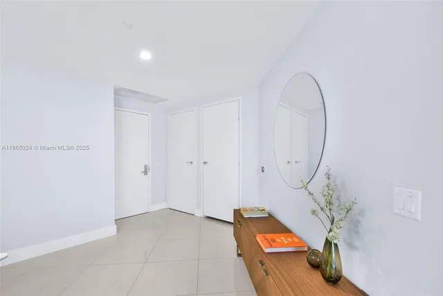 a kitchen with kitchen island a sink appliances and cabinets