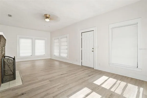 a kitchen with stainless steel appliances granite countertop a sink and dishwasher a stove top oven with wooden floor