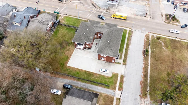 an aerial view of residential house with outdoor space and parking