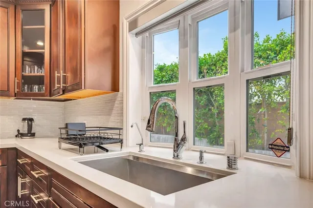 a kitchen with a sink and a large window