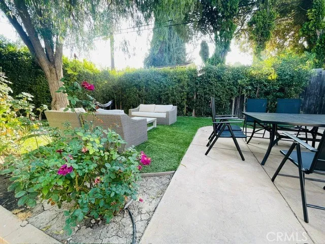 a view of a tables and chairs in a garden