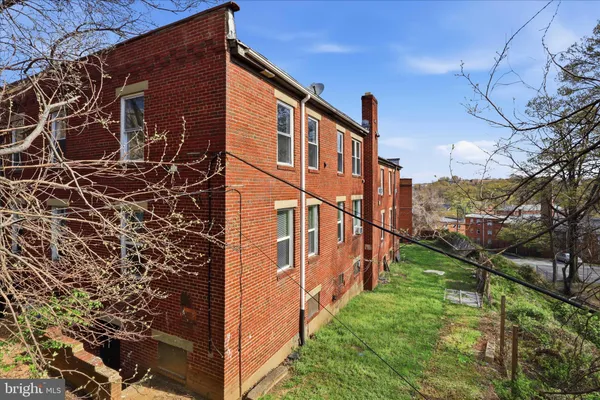 a view of a backyard of the house