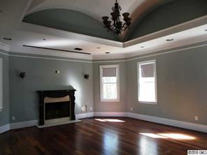 1663 Scotch Pine Lane Tega Cay, SC 29708 - Photo 6 of 16 a view of an empty room with wooden floor and a window