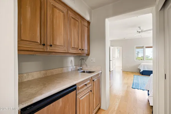 a view of a kitchen cabinets and a counter top space
