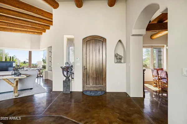 a view of a livingroom with furniture and front door