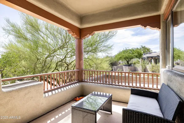 a balcony with wooden floor