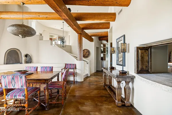 a dinning table and chairs in a room
