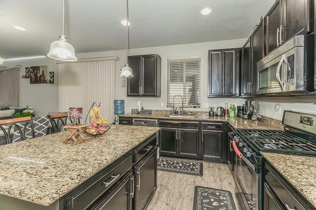 a kitchen with a stove and a kitchen island