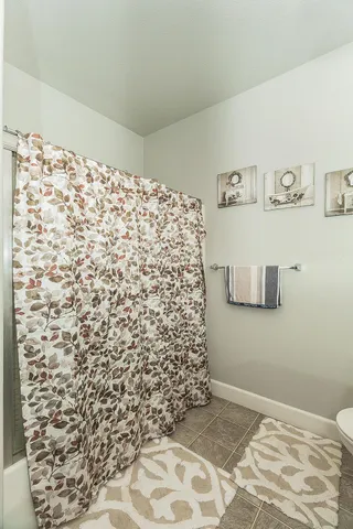 a bathroom with a shower curtain