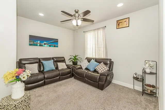 a living room with furniture and a window