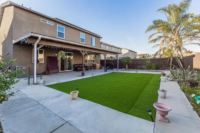 a view of a yard with a patio
