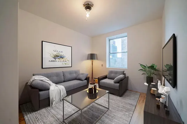 a living room with furniture and a window