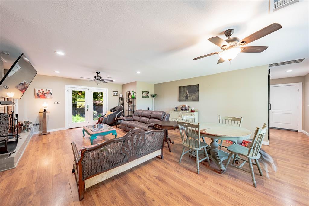 603 Mosley Road Athens, TX 75751 - Photo 5 of 14 a living room with furniture kitchen view and a wooden floor