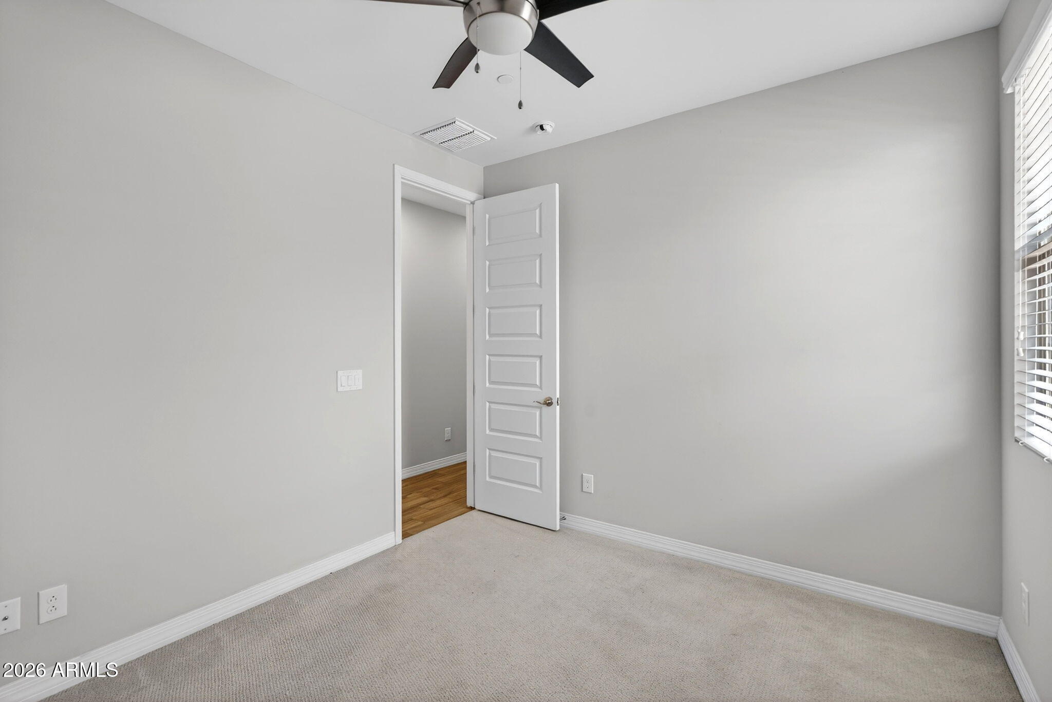 12124 West Peak View Road Peoria, AZ 85383 - Photo 28 of 38 an empty room with closet and fan