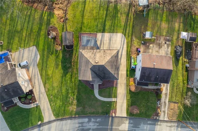 an aerial view of houses with outdoor space