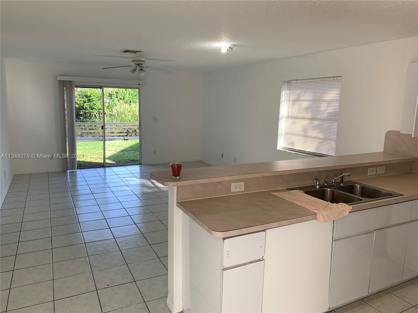 1016 Southwest 8th Street Hallandale Beach, FL 33009 - Photo 14 of 18 a utility room with washer and dryer
