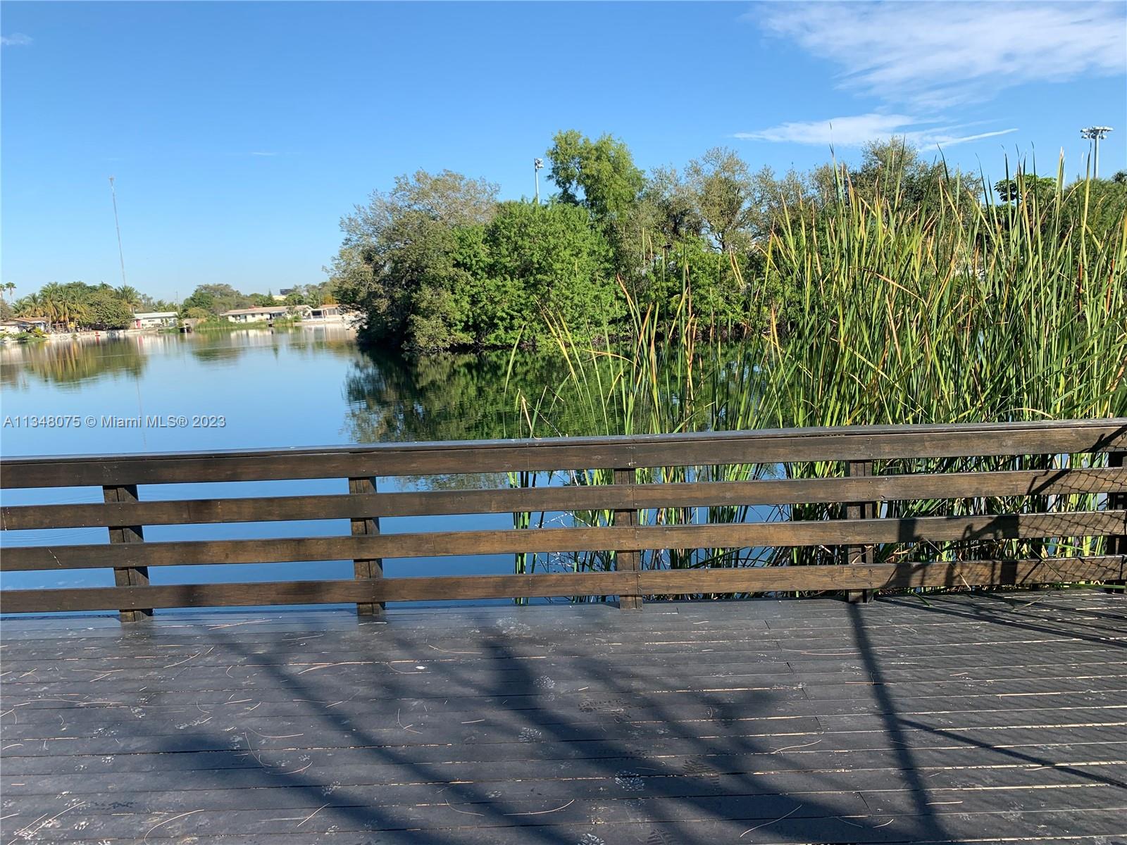 1016 Southwest 8th Street Hallandale Beach, FL 33009 - Photo 15 of 18 a view of park with wooden stairs