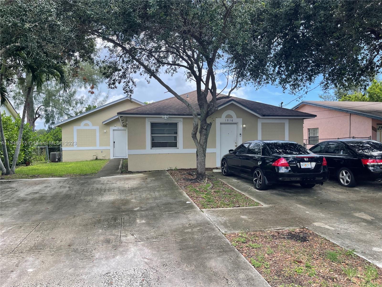 1016 Southwest 8th Street Hallandale Beach, FL 33009 - Photo 18 of 18 a view of a yard in front of a house