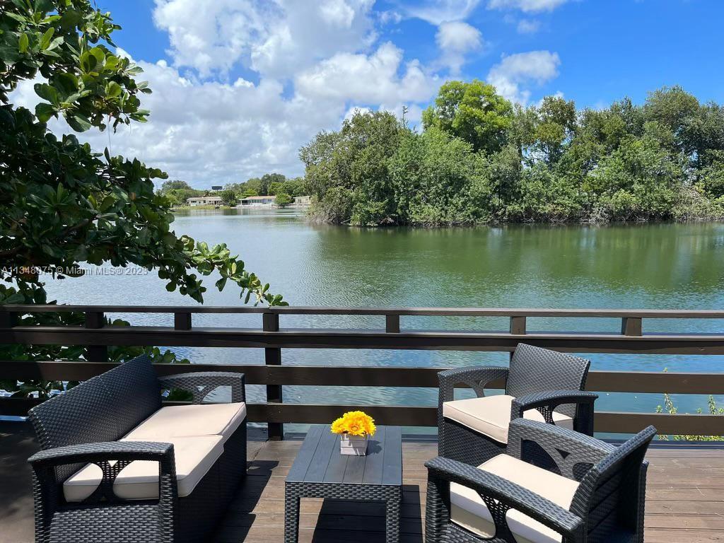 1016 Southwest 8th Street Hallandale Beach, FL 33009 - Photo 2 of 18 a view of a chairs and table in a terrace