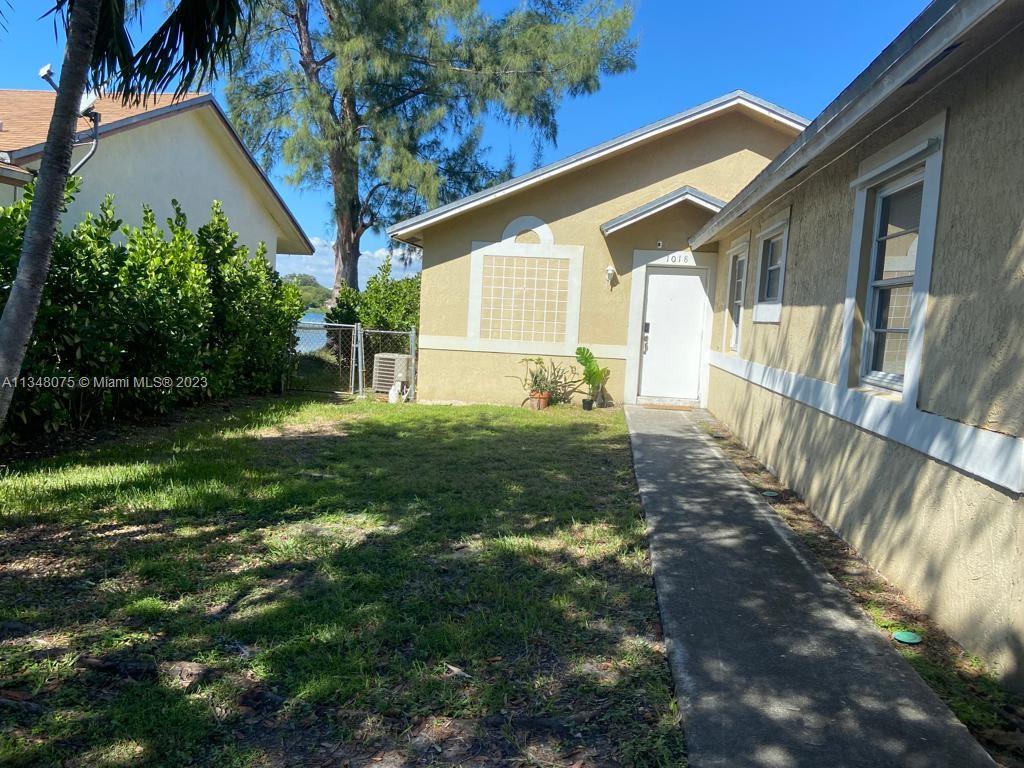 1016 Southwest 8th Street Hallandale Beach, FL 33009 - Photo 3 of 18 a view of a house with backyard and sitting area
