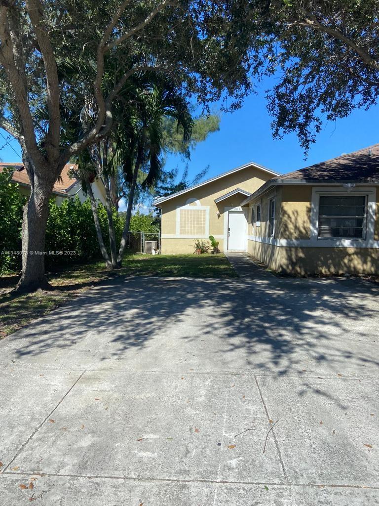 1016 Southwest 8th Street Hallandale Beach, FL 33009 - Photo 9 of 18 a view of a house with a yard