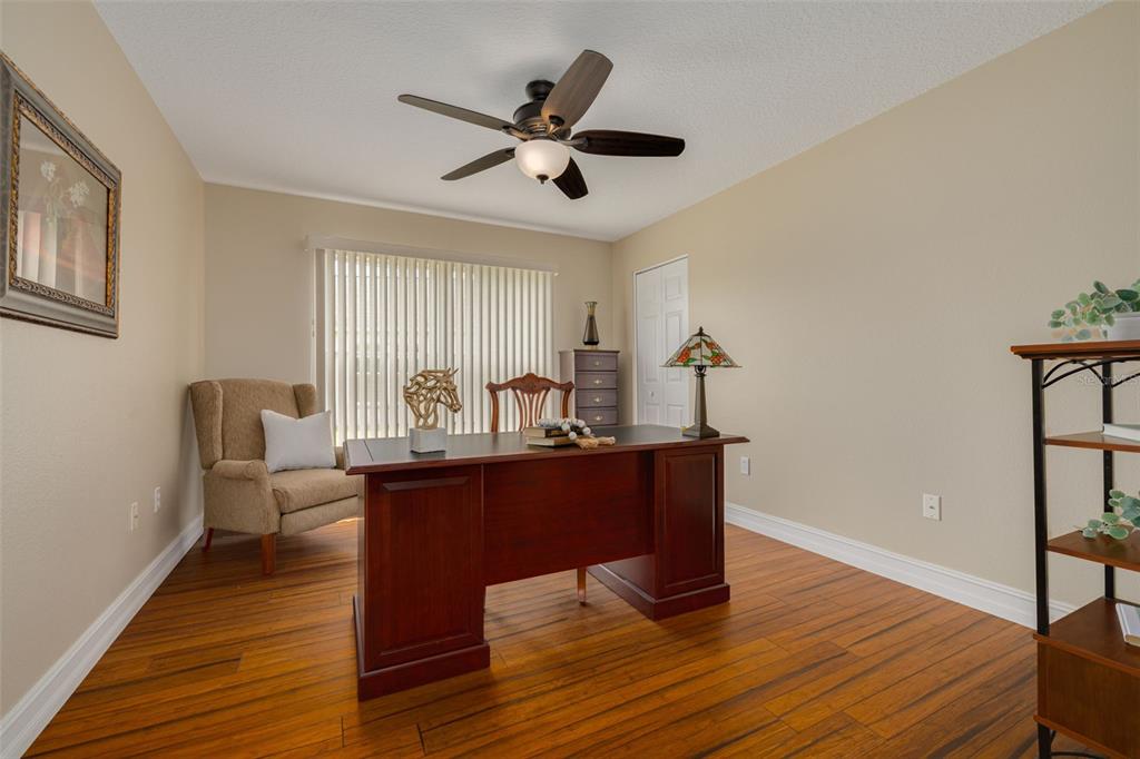 1701 Westerham Loop Trinity, FL 34655 - Photo 11 of 40 a living room with furniture and a wooden floor