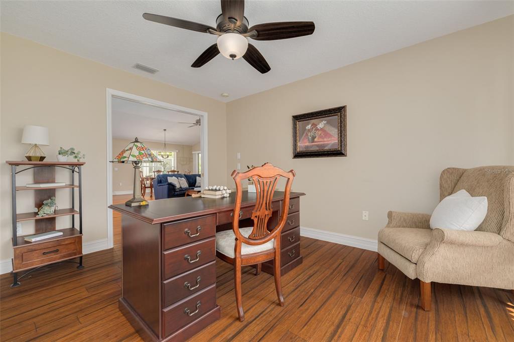 1701 Westerham Loop Trinity, FL 34655 - Photo 12 of 40 a living room with furniture and a wooden floor