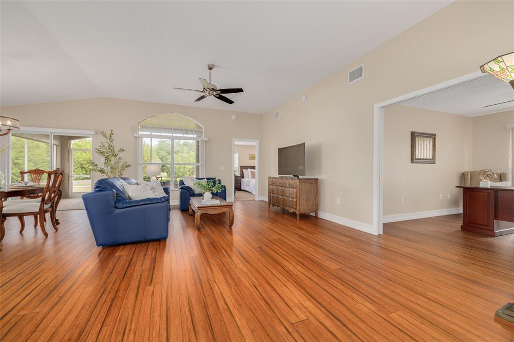 1701 Westerham Loop Trinity, FL 34655 - Photo 22 of 40 a living room with furniture and a wooden floor