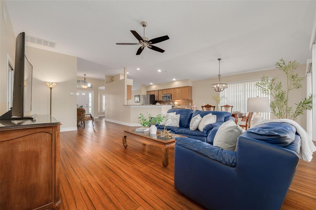1701 Westerham Loop Trinity, FL 34655 - Photo 24 of 40 a living room with furniture and a wooden floor